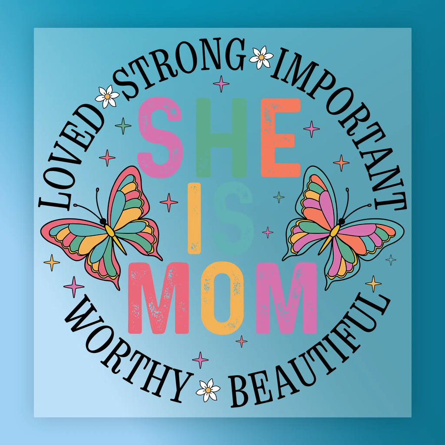 The image is a colorful graphic with the text "LOVED STRONG IMPORTANT SHE IS MOM WORTHY BEAUTIFUL" surrounding a circular design with butterflies.