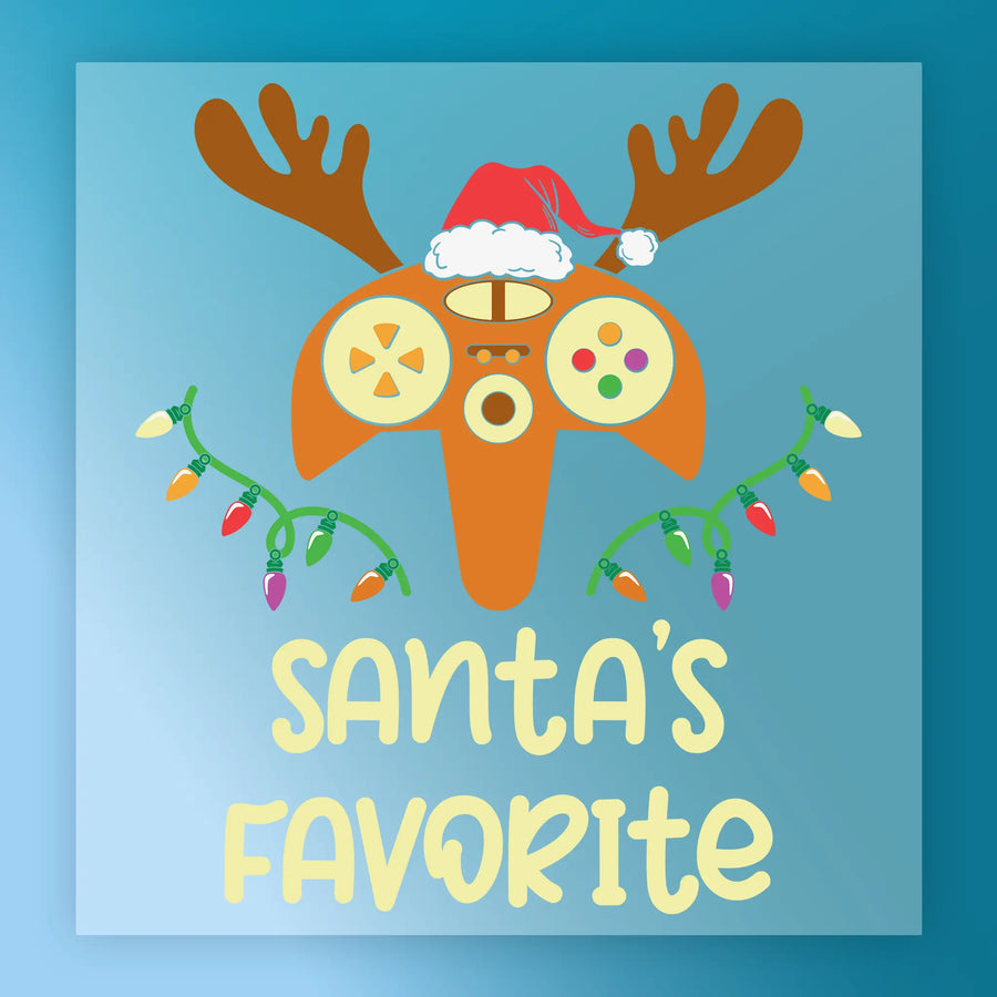 The Santa's Favorite Gamer shirt by InkMerge features a game controller with antlers, a Santa hat, and Christmas lights over "Santas Favorite" on blue—ideal for heat press or DTF transfer projects.