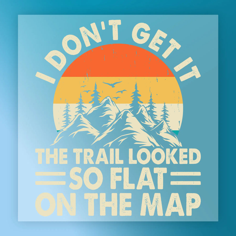 Good Times and Tan Lines Retro Sunset by InkMerge features a retro-style mountain scene with trees, two birds, and vibrant sunset. Text: I don’t get it. The trail looked so flat on the map. Ideal for heat press or DTF transfer designs.