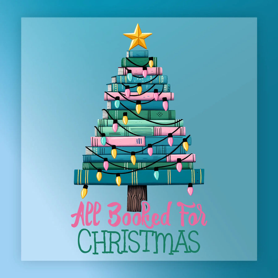 The All Booked For Christmas Design by InkMerge features a Christmas tree made of stacked books with pink and yellow lights, star topper, and "All Booked For Christmas" text on a light blue background—great for shirts or DTF transfers.