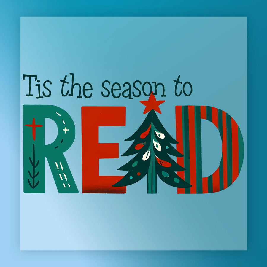 Square graphic from InkMerge: “Tis The Season To Read,” with “READ” in bold, festive letters and a Christmas tree as the “A.” Light blue background. Ideal for DTF transfers or precut ready-to-press holiday projects.
