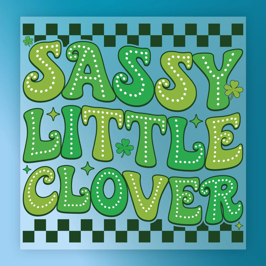a vibrant and playful design with the text "Sassy Little Clover" in a stylized font. The text is surrounded by various decorative elements such as stars, shamrocks, and checkered patterns, creating a visually appealing and whimsical composition.