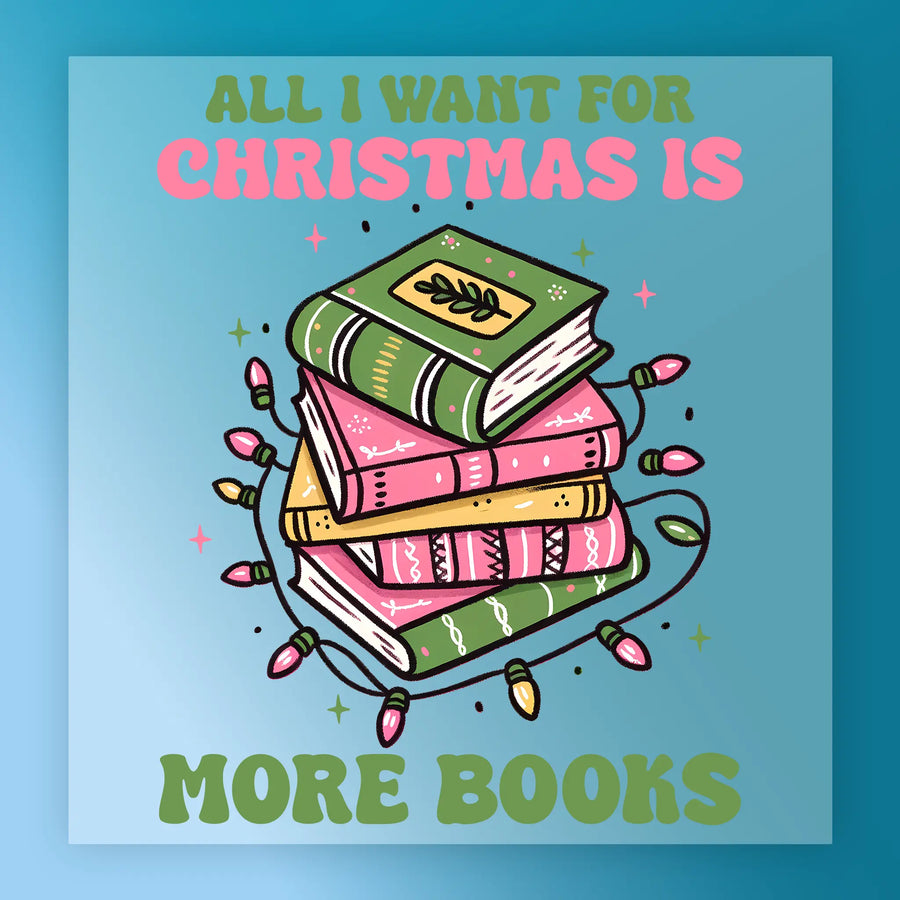 InkMerge’s “All I Want for Christmas Is More Books” DTF transfer features a stack of green and pink books wrapped in colorful lights, bold text above and below, and a blue background—perfect for book lovers this holiday season.