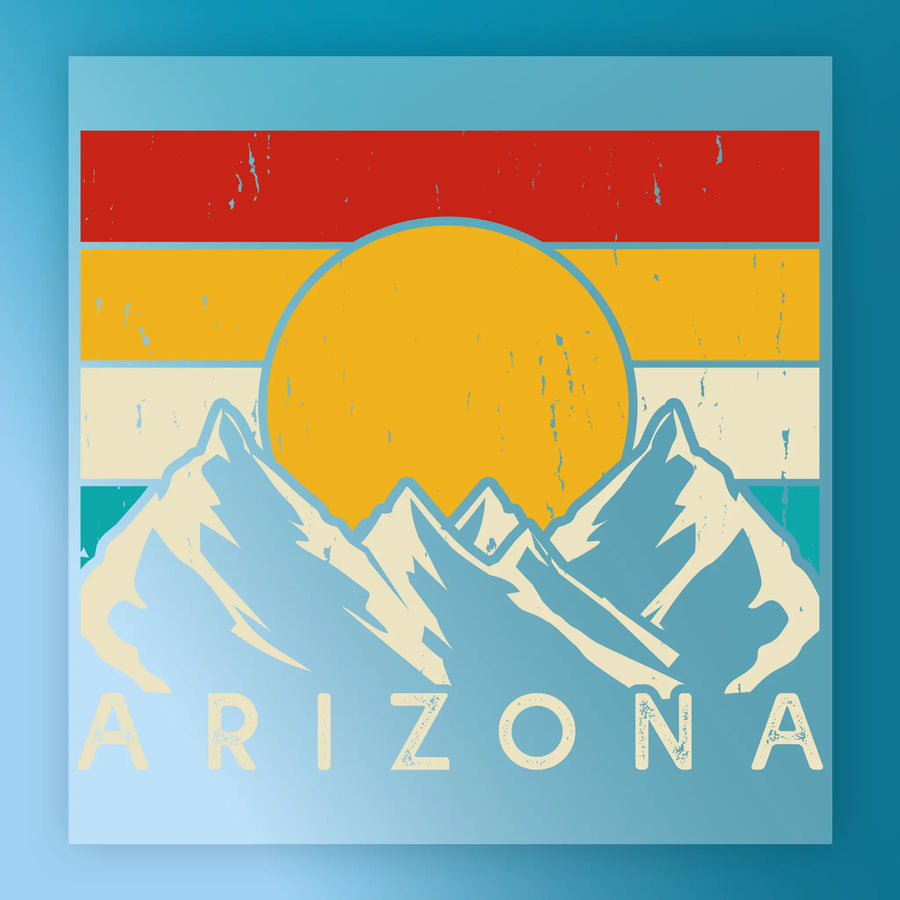 The Abstract Sunset Over Mountains Design by InkMerge shows snow-capped peaks beneath a vibrant striped sky and bold "ARIZONA" text—ideal for DTF or heat press transfer projects.