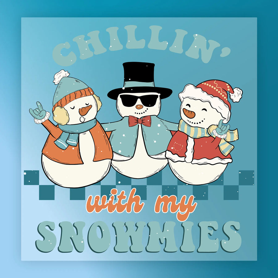The InkMerge Chillin' With My Snowmies Design features three cheerful snowmen in winter outfits, with playful text—ideal for custom apparel using DTF transfers and a heat press!.