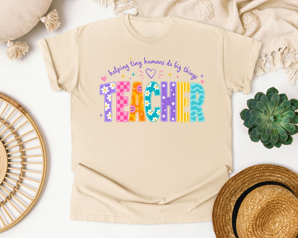 Teacher Helping Tiny Humans Do Big Things graphic tee in Ivory