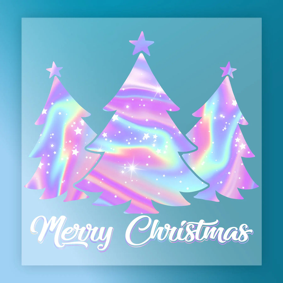 The Christmas Bow Stars Design by InkMerge features pastel rainbow trees with star toppers on a blue background, sparkling with stars and lights. "Merry Christmas" in white script makes it ideal for holiday heat press transfers or precut DTF film.