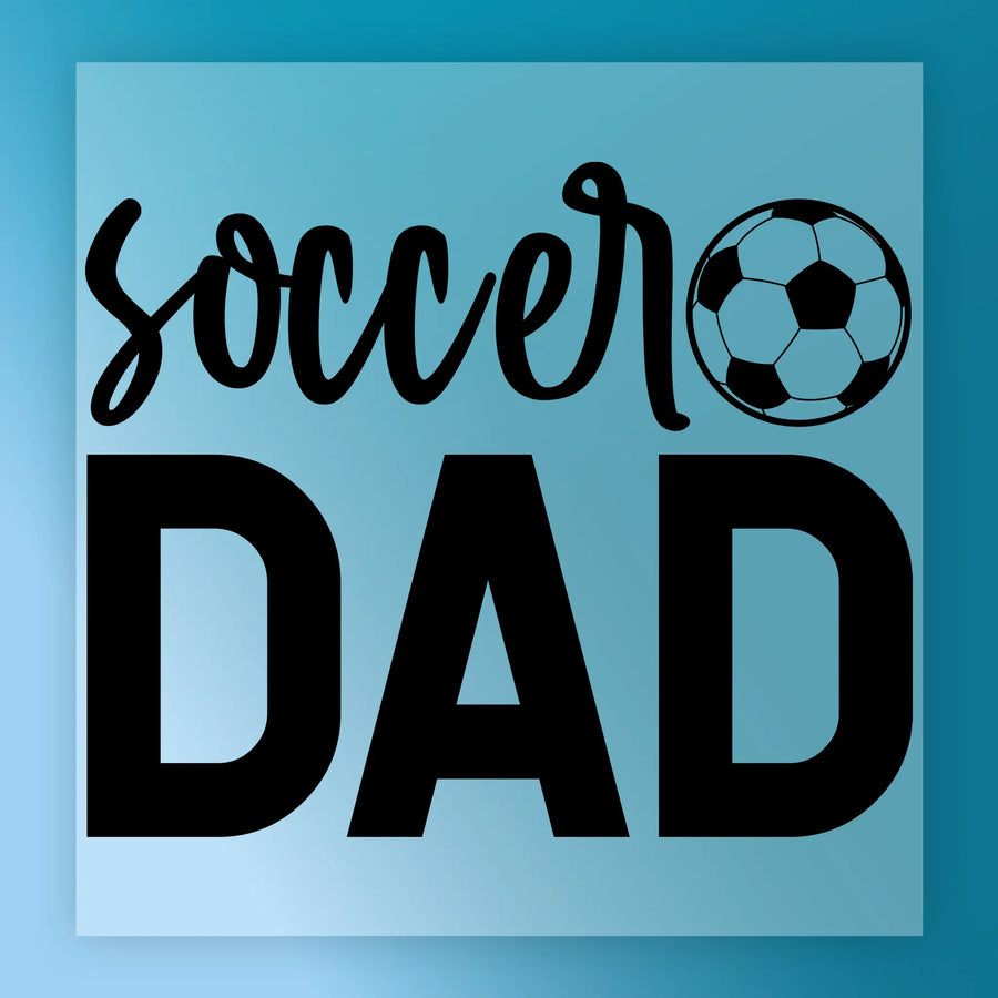 a large text that says "SOCCER DAD" in bold black letters, with a soccer ball graphic below it.