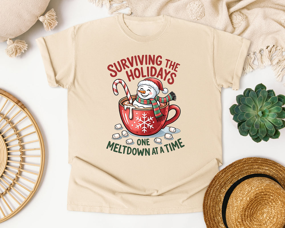 Surviving the Holidays One Meltdown at a Time graphic tee in Ivory Comfort Colors 1717