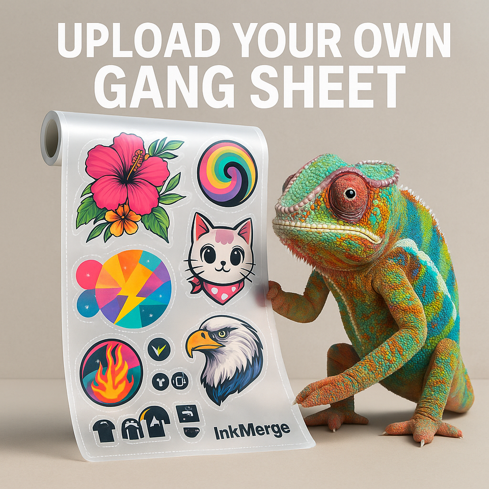 A chameleon touches vibrant stickers—flower, cat, eagle, spiral—below bold text: “Upload Your Own Gang Sheet” by inkmerge. Perfect for custom DTF transfers or easy use with a DTF film roll!.