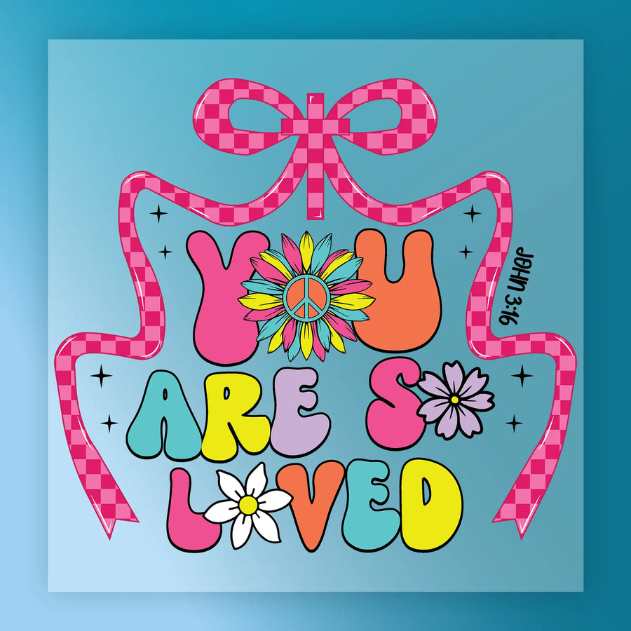 a colorful and whimsical design with the text "YOU ARE SO LOVED" prominently displayed. The design includes a peace sign, flowers, and a checkered ribbon, creating a cheerful and uplifting atmosphere.