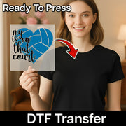 A woman is holding a sign with a heart-shaped design and text on it, and there is a red arrow pointing to her chest.