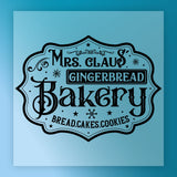 The InkMerge Mrs. Claus' Gingerbread Bakery Sign features vintage fonts, snowflakes, and swirls on a blue background—perfect for custom apparel transfers or as a charming Mrs. Claus' Gingerbread Bakery DTF transfer.