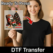 A smiling woman in a black t-shirt holds an InkMerge DTF transfer sheet with the All Booked For Christmas Santa Design, perfect for holiday apparel. "Ready To Press" and "DTF Transfer" text with an arrow highlights the festive transfer.