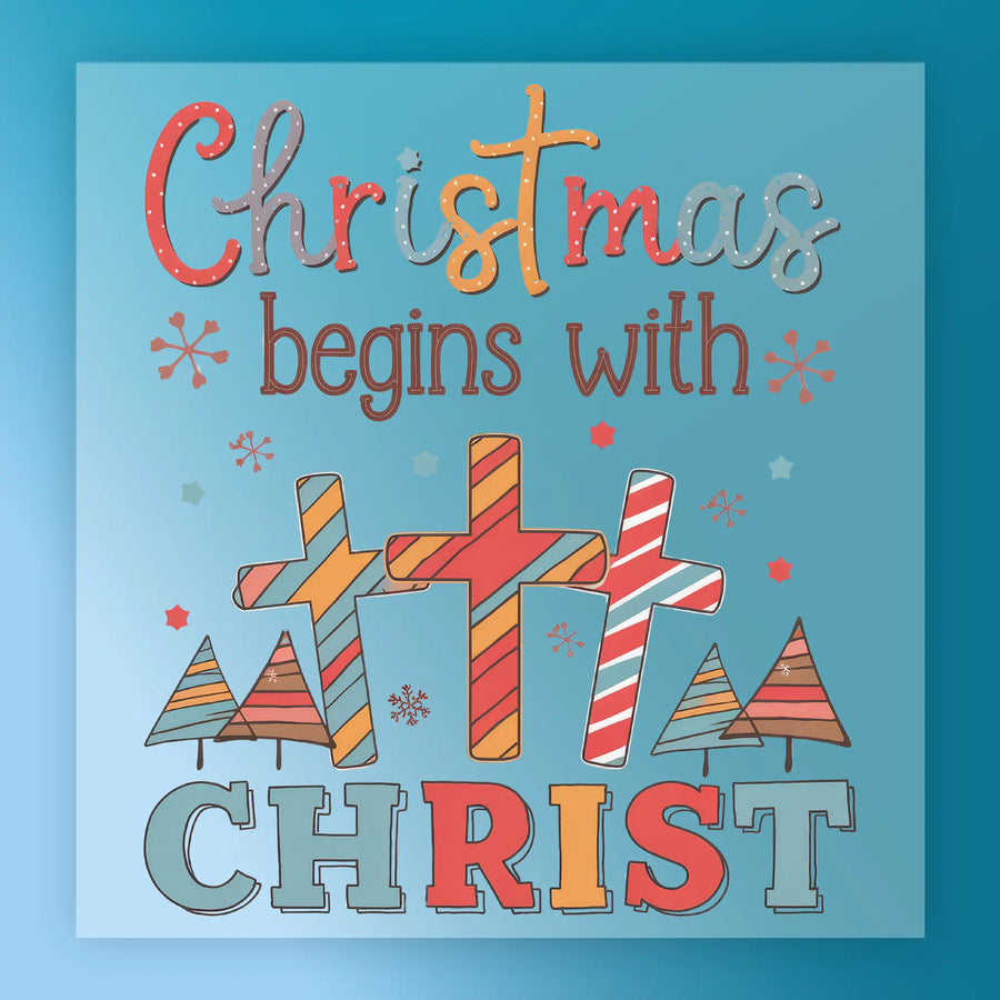 InkMerge’s Christmas Begins With Christ Design is a heat press-ready transfer featuring three decorated crosses, stylized trees, and snowflakes with playful fonts on a blue background—perfect for festive holiday projects.