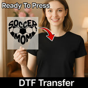 A smiling woman holding a sign with the text "SOCCER MOM" on it, with a red arrow pointing to the sign.