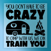 The Crazy Camper Humor sign by InkMerge features bold text: "You don’t have to be crazy to camp with us. We can train you," plus camper and campfire illustrations on a blue background—great for outdoor apparel or ready to press DTF transfers.