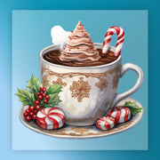 The Festive Hot Chocolate Holiday Design by InkMerge features a cup with a whipped cream tree, candy cane, holly sprig, and peppermint candies on a saucer—perfect for ready to press DTF transfers on a light blue background.