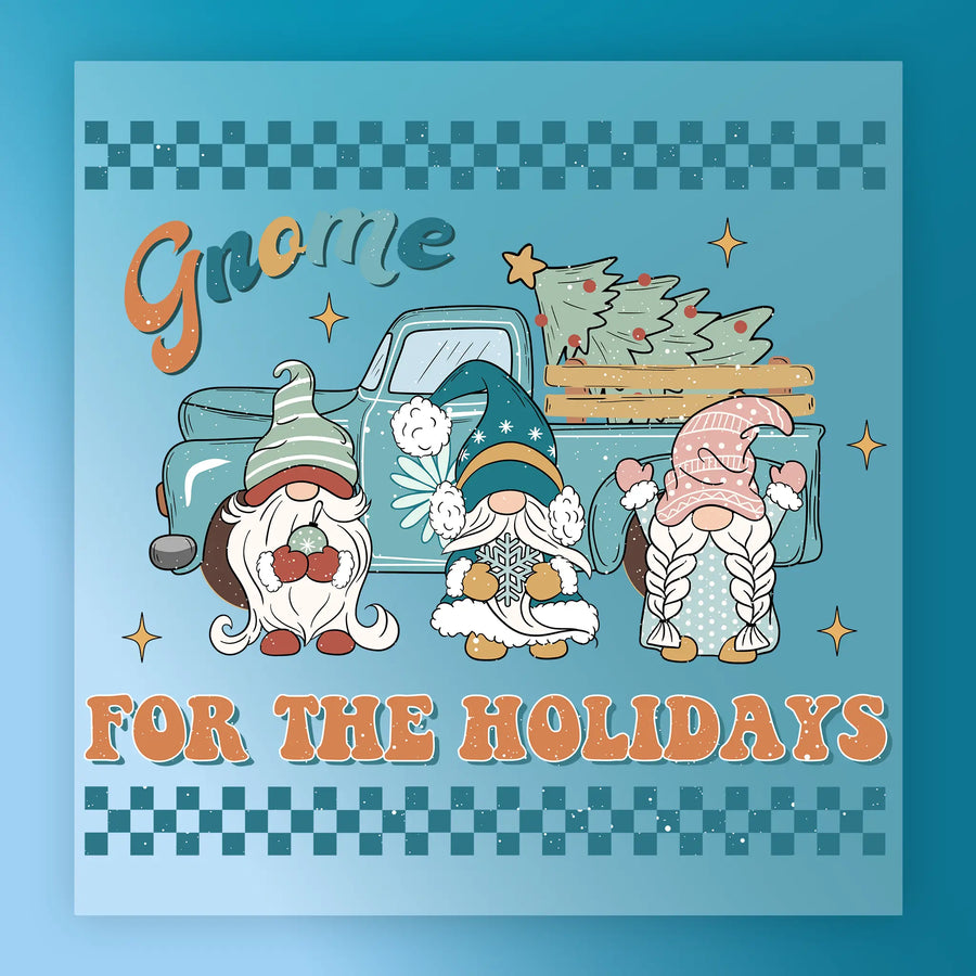 The InkMerge Gnome for the Holidays Design showcases three festive gnomes and a blue vintage truck with Christmas trees, plus "Gnome For The Holidays" text, stars, and checkerboard accents—ideal for your next heat press project.
