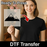 A woman holding a transparent sheet with a mountain icon on it, and there is a red arrow pointing to the icon.