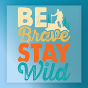 The Good Vibes Only Retro Text by InkMerge features “BE Brave STAY Wild” in bold, colorful fonts on a blue background with a hiker silhouette—ideal for custom apparel or screen printing.
