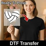 A smiling woman holding a heart-shaped sticker with a volleyball on it, and there is a red arrow pointing to the heart-shaped sticker.