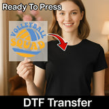 A smiling woman holding a sign with the word "Volleyball Squad" on it, with a red arrow pointing to her chest.