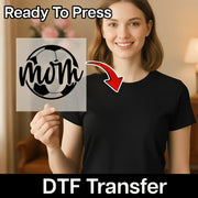A woman holding a clear sign with a soccer ball design on it, smiling and posing for the camera.