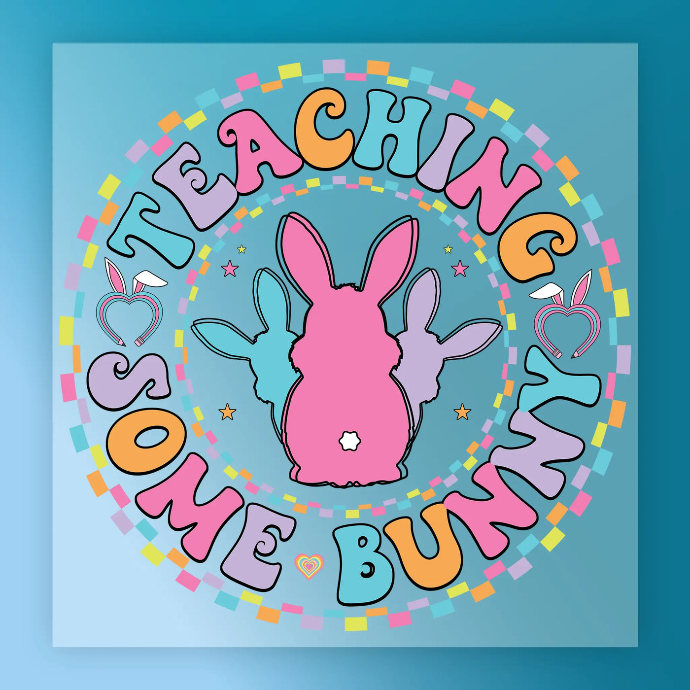 a colorful, circular design with the text "Teaching some bunny" written around it. The design includes a pink bunny, a purple bunny, and a blue bunny, all set against a blue background with a pattern of colorful squares.