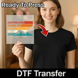 A smiling woman in a black t-shirt holds InkMerge's Good Vibes Only Retro Sunset Design DTF transfer sheet, perfect for your next heat press project. Text reads “Ready To Press” and “DTF Transfer.” Featuring a colorful retro sunset scene.