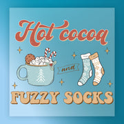 The InkMerge Hot Cocoa Fuzzy Socks Winter Design features a mug of cocoa, marshmallows, candy canes, a cookie, and cozy socks—ideal for DTF transfer designs with your heat press.