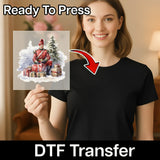 A woman in a black shirt holds an InkMerge DTF film transfer sheet featuring the Vintage Christmas Soldier in Snow design. An arrow points from the sheet to her shirt. The text reads Ready To Press and heat press transfer.