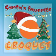 Festive InkMerge design "Santa's Favorite Croquet" features an orange ball in a Santa hat, croquet mallets, decorated trees, and string lights on blue—perfect for DTF transfer or heat press holiday projects.