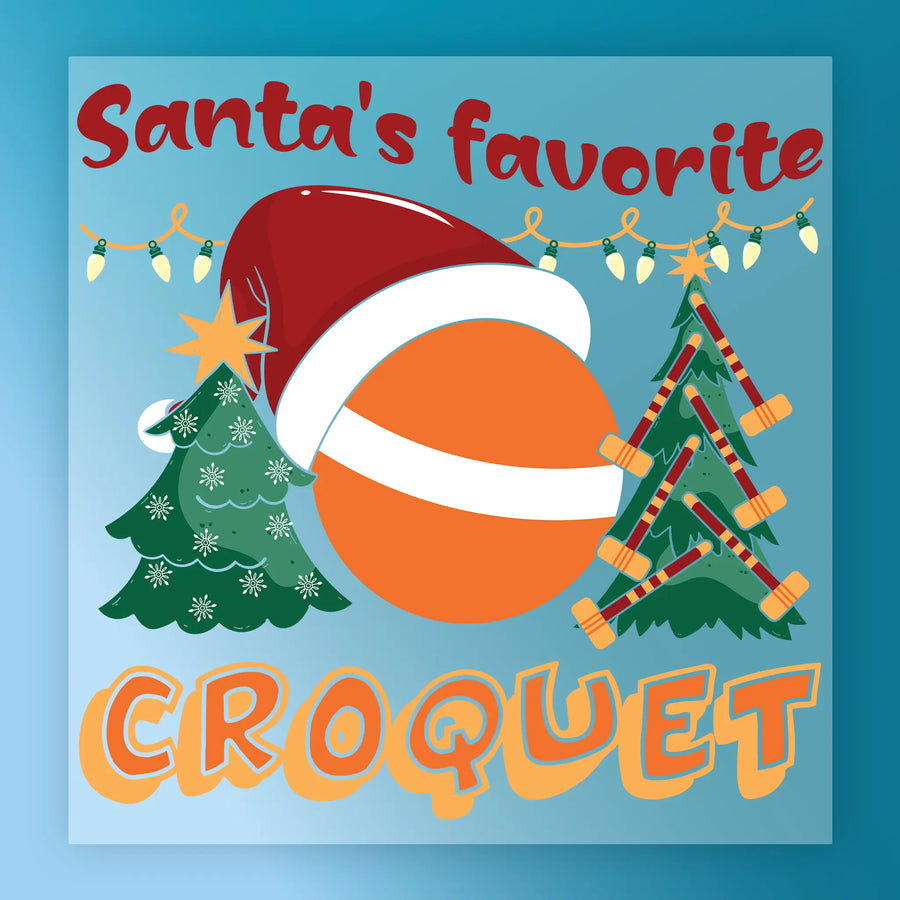 Festive InkMerge design "Santa's Favorite Croquet" features an orange ball in a Santa hat, croquet mallets, decorated trees, and string lights on blue—perfect for DTF transfer or heat press holiday projects.