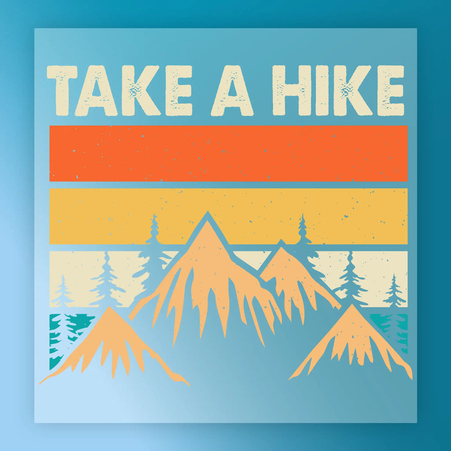 InkMerge Retro Mountain Sunset Design - Heat Press Ready: Features "TAKE A HIKE" above orange/yellow stripes, mountain and tree silhouettes on a blue background—ideal for heat press or DTF transfers.