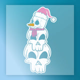 InkMerge’s Quirky Snowman Pink Santa Hat Design features three stacked skulls, a pink scarf, and carrot nose on a blue gradient background—ideal for heat press or DTF transfers.