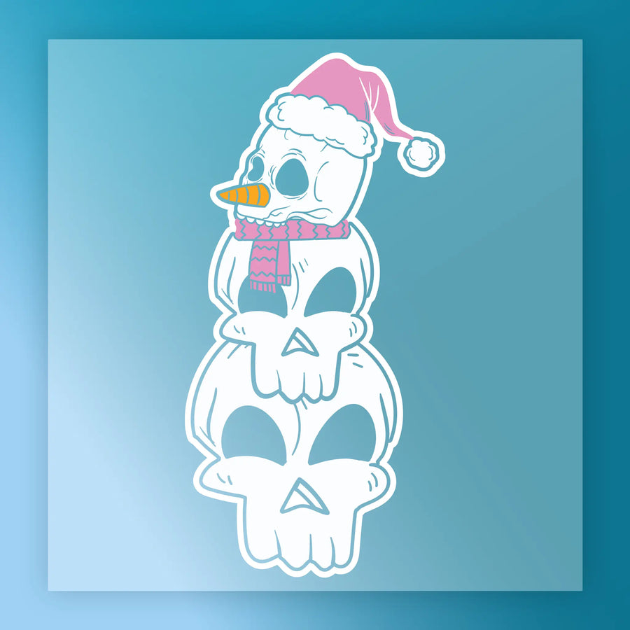 InkMerge’s Quirky Snowman Pink Santa Hat Design features three stacked skulls, a pink scarf, and carrot nose on a blue gradient background—ideal for heat press or DTF transfers.