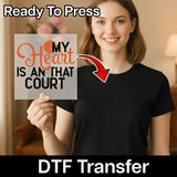 A woman holding a sign with the text "MY HEART IS AN THAT COURT" and a red arrow pointing to her chest.