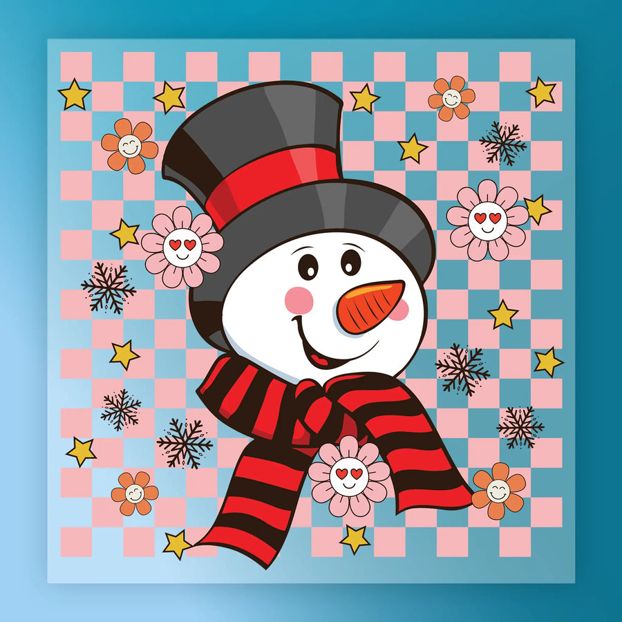 InkMerge’s Cheerful Snowman & Stars Design features a smiling snowman in a red-and-black hat and scarf, set on a pink and blue checkered background with flowers, stars, and snowflakes—ideal for holiday heat press transfers.