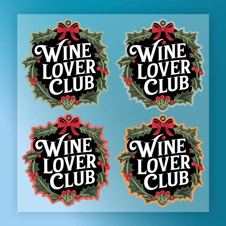InkMerge’s Wine Lover Club Festive Wreath Design includes four ready-to-press stickers, each displaying "Wine Lover Club" inside a holly and berry wreath with a red bow, featuring black, blue, red, or orange outlines.