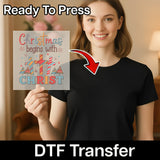 A smiling woman in a black shirt displays the "Christmas Begins With Christ Design - Heat Press Ready" by InkMerge. An arrow highlights the precut DTF transfer, labeled as ready to press and perfect for holiday heat pressing.