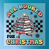 The All Booked Christmas Design by InkMerge features cheerful, colorful books with arms, legs, and Christmas lights topped with a star on a snowy checkered background. Ideal for heat press or DTF transfer. Text: "All Booked for Christmas.