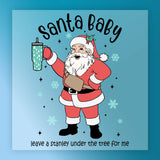 The Santa Claus Festive Tumbler Design by InkMerge shows Santa holding a green patterned tumbler, surrounded by snowflakes and stars, with "Santa Baby" above and "leave a stanley under the tree for me" below in a festive heat press style.