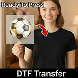 A woman holding a transparent sheet with a soccer ball image on it, and there is text that says "Ready To Press" and "DTF Transfer" below the image.