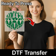 A woman holding a sign with the word "SOCCER" on it, smiling and posing for the camera.