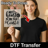 A smiling woman holding a sign with text that says "My heart is on that court".