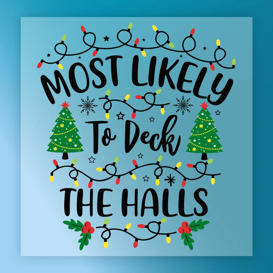 Festive graphic by InkMerge: "Most Likely To Deck The Halls" features Christmas lights, stars, and two decorated trees on a blue background with holly accents—ideal for custom apparel using heat press or DTF transfer.