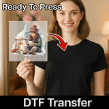 A smiling woman in a black shirt holds InkMerge's Nostalgic Christmas Scene DTF transfer, showing a child by the fireplace with a mug. Ready To Press—this festive design is perfect for custom holiday apparel.