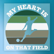 a soccer player kicking a ball, with the text "MY HEART IS ON THAT FIELD" written above the player.