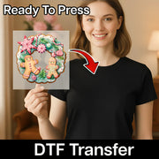 A smiling woman in a black shirt holds the InkMerge Gingerbread Candy Cane Wreath DTF Transfer, ideal for your next heat press project. “Ready To Press” and “DTF Transfer” are featured on the image.